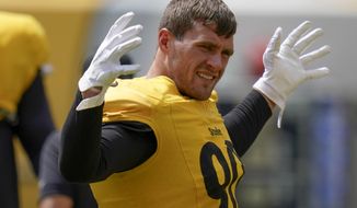 Pittsburgh Steelers linebacker T.J. Watt (90) warms up during an NFL football training camp practice, Monday, Aug. 24, 2020, in Pittsburgh. Watt is coming off a season in which he finished with 14 1/2 sacks and reached the Pro Bowl for the second straight year. (AP Photo/Keith Srakocic)