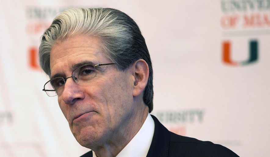 FILE - In this April 13, 2015, file photo Dr. Julio Frenk, then-dean of Harvard' school of public health and former Mexican Cabinet member, speaks at a press conference where he was named as the new president of the University of Miami in Coral Gables, Fla. The presidents of the University of Miami and Notre Dame say in separate interviews that they expect the football season to be played, though both raised the very real possibility of crowds being much smaller than usual or eliminated entirely. (AP Photo/J Pat Carter, File)
