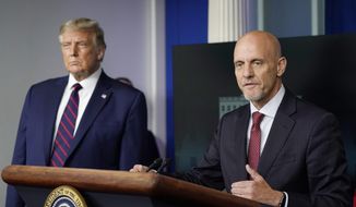 President Donald Trump listens as Dr. Stephen Hahn, commissioner of the U.S. Food and Drug Administration, speaks during a media briefing in the James Brady Briefing Room of the White House, Sunday, Aug. 23, 2020, in Washington.(AP Photo/Alex Brandon)