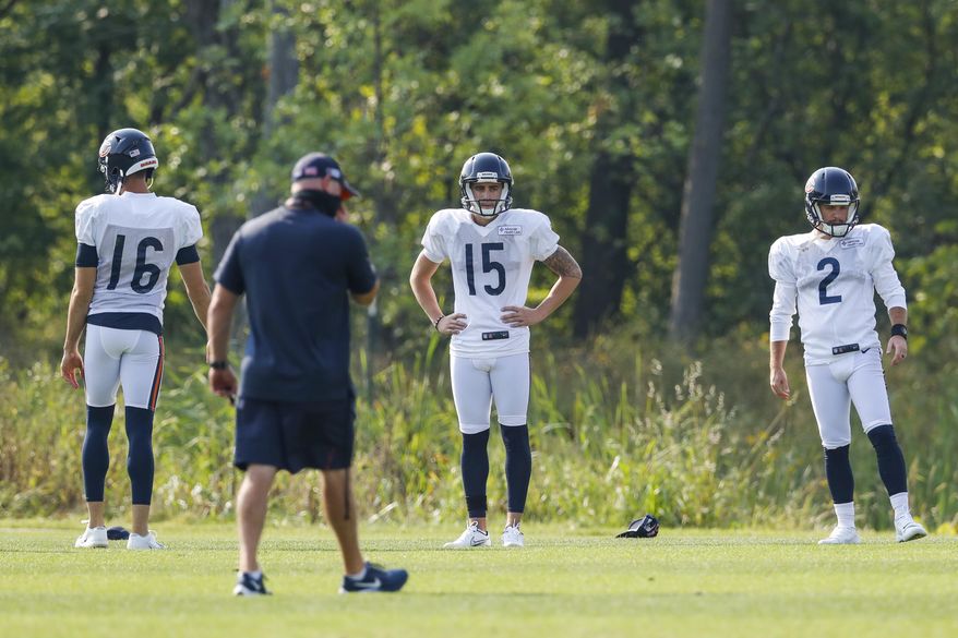 Chicago Bears punter Pat O'Donnell (16), and placekickers Eddy Pineiro (15) and Cairo Santos warm up during NFL football training camp at Halas Hall in Lake Forest, Ill., on Wednesday, Aug. 26, 2020. (Jose M. Osorio/ Chicago Tribune via AP, Pool)