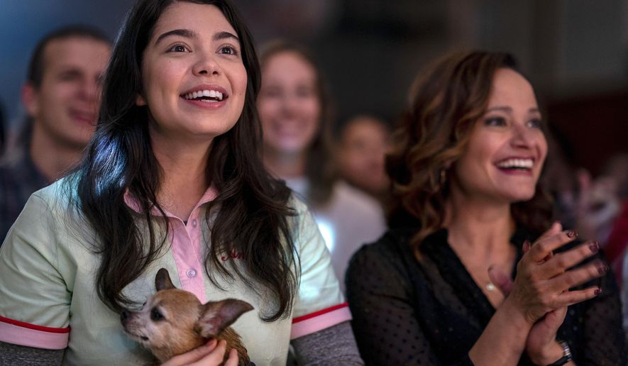 CORRECTS SPELLING OF CRAVALHO'S FIRST NAME - This image released by Netflix shows Auli'i Cravalho, left, and Judy Reyes in a scene from "All Together Now." (Allyson Riggs/Netflix via AP)