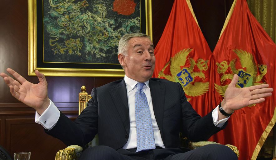FILE - In this Thursday, April 4, 2019 file photo, Montenegro President Milo Djukanovic speaks and gestures during an interview to The Associated Press in Montenegro&#x27;s capital Podgorica. Montenegro&#x27;s president says the upcoming parliamentary vote is crucial in the defense of the small Balkan country&#x27;s independence in the face of renewed attempts from Serbia and Russia to install their nationalist and anti-Western allies to power. (AP Photo/Risto Bozovic, File)