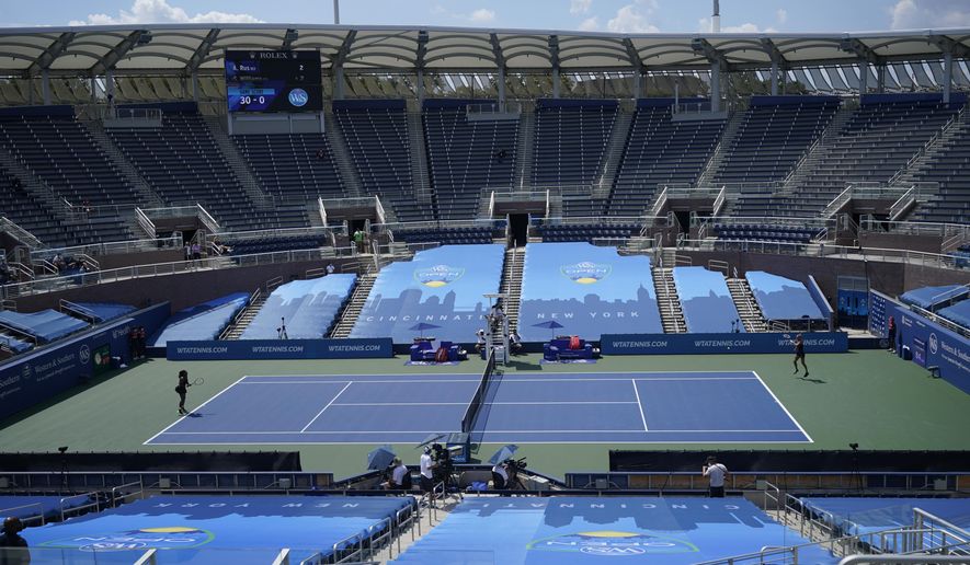 FILE - In this Monday, Aug. 24, 2020, file photo, Arantxa Rus, of the Netherlands, right, returns a shot from Serena Williams during a match at the Western & Southern Open tennis tournament in New York. In a year unlike any other, there will be a U.S. Open tournament unlike any other. (AP Photo/Frank Franklin II, File)