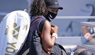 Naomi Osaka, of Japan, leaves the court after winning her match with Anett Kontaveit, of Estonia, during the quarterfinals at the Western &amp;amp; Southern Open tennis tournament Wednesday, Aug. 26, 2020, in New York. (AP Photo/Frank Franklin II)