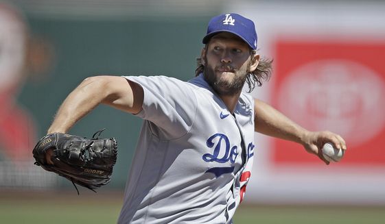 Los Angeles Dodgers&#39; pitcher Clayton Kershaw works against the San Francisco Giants in the first inning of the first game of a baseball doubleheader Thursday, Aug. 27, 2020, in San Francisco. (AP Photo/Ben Margot)