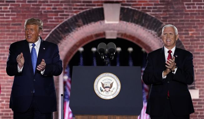 Vice President Mike Pence stands on stage with President Donald Trump after Pence spoke on the third day of the Republican National Convention at Fort McHenry National Monument and Historic Shrine in Baltimore, Wednesday, Aug. 26, 2020. (AP Photo/Andrew Harnik)