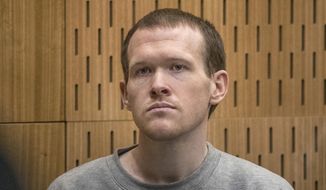 Australian Brenton Harrison Tarrant, 29, sits in the dock on the final day of his sentencing hearing at the Christchurch High Court after pleading guilty to 51 counts of murder, 40 counts of attempted murder and one count of terrorism in Christchurch, New Zealand, Thursday, Aug. 27, 2020. The white supremacist who killed 51 worshippers at two New Zealand mosques in March 2019 was sentenced to life in prison without parole. (John Kirk-Anderson/Pool Photo via AP)