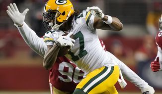 FILE - Green Bay Packers wide receiver Davante Adams (17) runs in front of San Francisco 49ers defensive tackle Sheldon Day during the second half of the NFL NFC Championship football game in Santa Clara, Calif. (AP Photo/Tony Avelar, File)