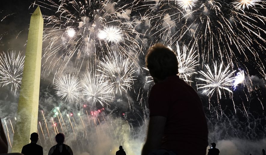 People watch fireworks near the Washington Monument on the fourth day of the Republican National Convention, Thursday, Aug. 27, 2020, in Washington. (AP Photo/Andrew Harnik)