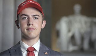 In this Tuesday, Aug. 25, 2020 image from video provided by the RNC, Nicholas Sandmann wears a &#39;Make America Great Again&#39; hat as speaks from Washington, during the second night of the Republican National Convention. Senate Majority Leader Mitch McConnell&#39;s campaign has hired Sandmann, a Kentucky teenager known for his viral encounter with a Native American man at the Lincoln Memorial last year. (Committee on Arrangements for the 2020 Republican National Committee via AP)