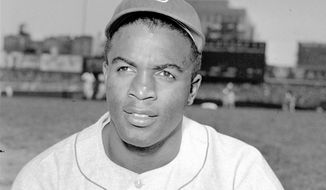 FILE - This is an April 18, 1948, portrait of Brooklyn Dodgers baseball player Jackie Robinson. It&#x27;s Jackie Robinson Day across the big leagues on Friday, Aug. 28, 2020, as baseball honors the man who broke the sport&#x27;s color barrier in 1947.  (AP Photo/File)