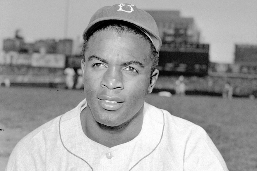 FILE - This is an April 18, 1948, portrait of Brooklyn Dodgers baseball player Jackie Robinson. It&#39;s Jackie Robinson Day across the big leagues on Friday, Aug. 28, 2020, as baseball honors the man who broke the sport&#39;s color barrier in 1947.  (AP Photo/File)