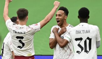 Arsenal&#39;s Pierre-Emerick Aubameyang, 2nd right, celebrates after scoring the opening goal during the English FA Community Shield soccer match between Arsenal and Liverpool at Wembley stadium in London, Saturday, Aug. 29, 2020. (Justin Tallis/Pool via AP)