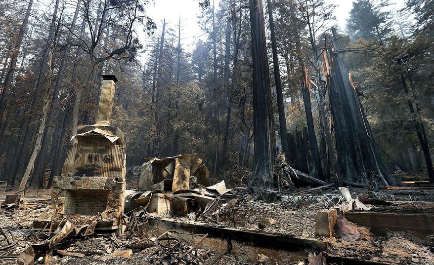 The fireplace of the Nature Lodge Museum and Store at Big Basin Redwoods State Park stands among the devastation Friday, Aug. 28, 2020, in Boulder Creek, Calif., wrought by the CZU August Lightning Complex, which destroyed nearly all buildings and burned thousands of trees at the park. (Shmuel Thaler/The Santa Cruz Sentinel via AP)