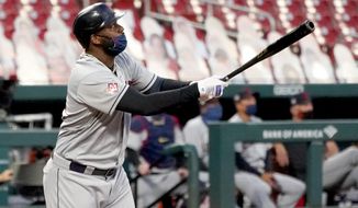 Cleveland Indians&#39; Franmil Reyes watches his three-run home run during the first inning of a baseball game against the St. Louis Cardinals Friday, Aug. 28, 2020, in St. Louis. (AP Photo/Jeff Roberson)