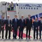 U.S. Presidential Adviser Jared Kushner, center right, and U.S. National Security Adviser Robert O&#39;Brien, center left, pose with members of the Israeli-American delegation in front of the El Al&#39;s flight, which will carry the delegation from Tel Aviv to Abu Dhabi, at the Ben Gurion Airport near Tel Aviv Monday, Aug. 31, 2020. (Menahem Kahana/Pool Photo via AP)