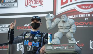 Kevin Harvick celebrates after winning a NASCAR Cup Series auto race at Dover International Speedway, Sunday, Aug. 23, 2020, in Dover, Del. (AP Photo/Jason Minto)