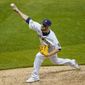 Milwaukee Brewers relief pitcher David Phelps throws during the seventh inning of a baseball game against the Pittsburgh Pirates Friday, Aug. 28, 2020, in Milwaukee. (AP Photo/Morry Gash)