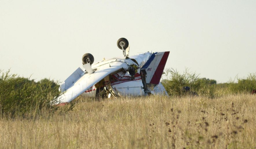 A plane is seen after crashing at Coulter Field in Bryan, Texas, Sunday, Aug. 30, 2020. (Darren Benson/College Station Eagle via AP)