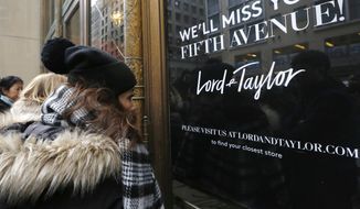 FILE - In this Jan. 2, 2019 file photo, women peer in the front door of Lord &amp;amp; Taylor&#39;s flagship Fifth Avenue store which closed for good,  in New York. A slew of once-beloved brands from Lord &amp;amp; Taylor to Ann Taylor have filed for Chapter 11 since the pandemic. Many shoppers will see these iconic labels vanish or become mere shadows of themselves as they drastically shrink their businesses or get acquired. But while loyal customers bemoan their loss, the brands themselves have been clearly losing favor for year.  (AP Photo/Kathy Willens, File)