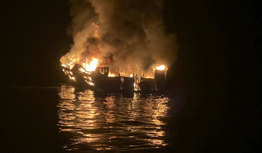 FILE - In this Sept. 2, 2019, file photo provided by the Santa Barbara County Fire Department, the dive boat Conception is engulfed in flames after a deadly fire broke out aboard the commercial scuba diving vessel off the Southern California Coast. Court documents say criminal charges are imminent in the investigation of the fire that killed 34 people aboard the scuba boat Conception last year off the coast of Southern California. (Santa Barbara County Fire Department via AP, File)