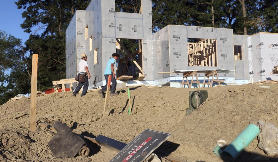 A new home is under construction on Wednesday, Aug. 19, 2020, in Pine Township, Pa.  U.S. construction spending edged up a tiny 0.1% in July, breaking a string of losses due to disruptions caused by the coronavirus pandemic. (AP Photo/Ted Shaffrey)