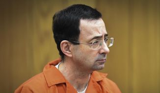 In this Feb. 5, 2018, file photo, Larry Nassar, former sports doctor who admitted molesting some of the nation&#39;s top gymnasts, appears in Eaton County Court in Charlotte, Mich. (Matthew Dae Smith/Lansing State Journal via AP, File)