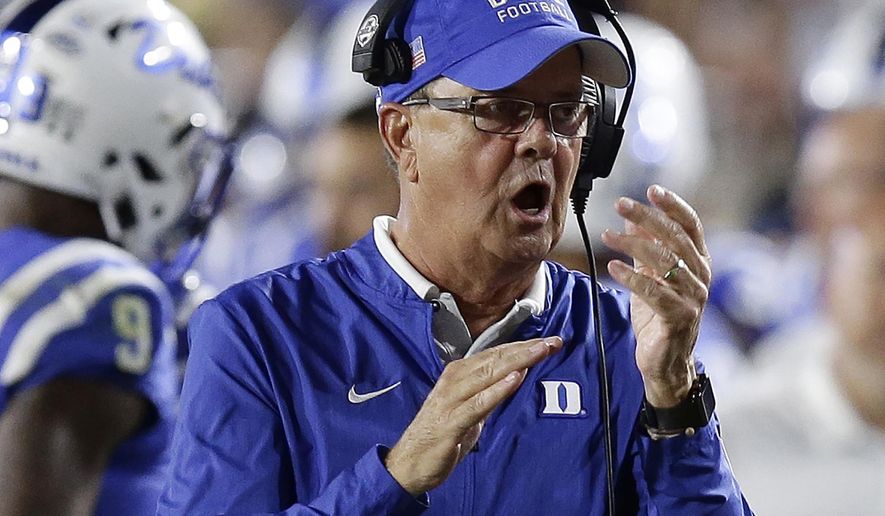 FILE - In this Saturday, Sept. 29, 2018, file photo, Duke head coach David Cutcliffe reacts during the second half of an NCAA college football game against Virginia Tech in Durham, N.C. Cutcliffe is taking over playcalling duties in hopes of helping the Blue Devils find an offensive spark in 2020 after struggling to some of their lowest totals under Cutcliffe the previous season. (AP Photo/Gerry Broome, File)