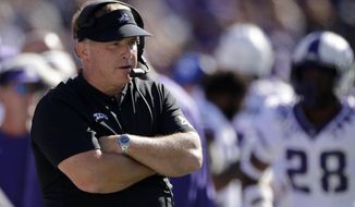 FILE - In this Oct. 19, 2019, file photo, TCU coach Gary Patterson watches during the first half of the team&#x27;s NCAA college football game against Kansas State in Manhattan, Kan. The coronavirus pandemic has caused TCU coach Gary Patterson to pay attention to the details of things he never would have thought about in the past. He&#x27;s going into his 20th season as head coach of the Horned Frogs. The virus has altered how things are being done on and off the field. (AP Photo/Charlie Riedel, File)