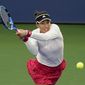 Garbine Muguruza, of Spain, returns a shot to Nao Hibino, of Japan, during the first round of the US Open tennis championships, Tuesday, Sept. 1, 2020, in New York. (AP Photo/Seth Wenig)