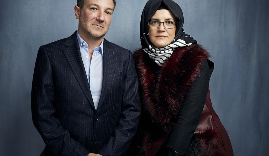 FILE - Director Bryan Fogel, left, and Hatice Cengiz, fiancee of the murdered journalist Jamal Khashoggi, pose for a portrait to promote the film &amp;quot;The Dissident&amp;quot; during the Sundance Film Festival in Park City, Utah on Jan. 24, 2020.  Briarcliff Entertainment said Wednesday that it has acquired “The Dissident” and will release it theatrically and via on-demand in late 2020 to coincide with the second anniversary of Khashoggi’s death. (Photo by Taylor Jewell/Invision/AP, File)