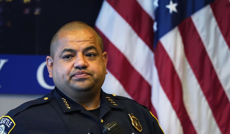 Interim Seattle Police Chief Adrian Diaz listens to a question during a news conference about changes being made at the department Wednesday, Sept. 2, 2020, in Seattle. (AP Photo/Elaine Thompson) ** FILE **