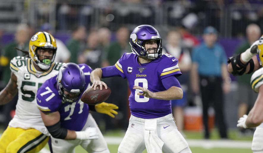 In this Monday, Dec. 23, 2019, file photo, Minnesota Vikings quarterback Kirk Cousins throws a pass during the second half of an NFL football game against the Green Bay Packers in Minneapolis. (AP Photo/Andy Clayton-King, File)