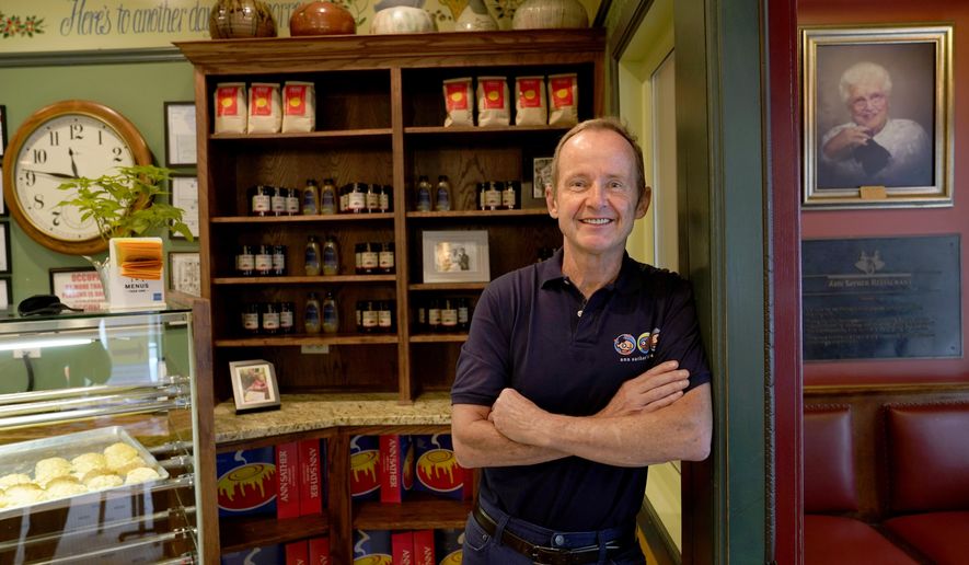 Chicago Alderman Tom Tunney poses inside his main Ann Sather restaurant, Tuesday, Sept. 1, 2020, in Chicago. Tunney estimates he's put $250,000 of his own money into running his three Ann Sather restaurants. (AP Photo/Charles Rex Arbogast)