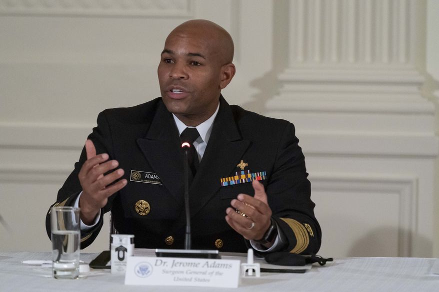 U.S. Surgeon General Jerome Adams speaks during a roundtable discussion about "Recovery at Work: Celebrating Connections," in the East Room of the White House, Thursday, Sept. 3, 2020, in Washington. (AP Photo/Alex Brandon) ** FILE **
