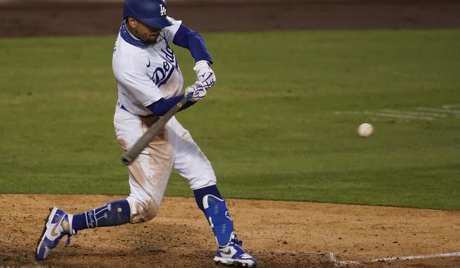 Los Angeles Dodgers&#x27; Mookie Betts connects for a solo home run during the ninth inning of the team&#x27;s baseball game against the Arizona Diamondbacks on Wednesday, Sept. 2, 2020, in Los Angeles. (AP Photo/Marcio Jose Sanchez)
