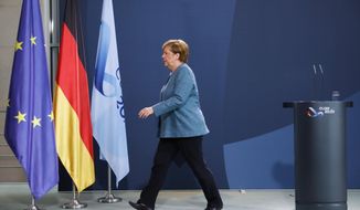 German Chancellor Angela Merkel leaves after a statement about latest developments in the case of Russian opposition leader Alexei Navalny at the chancellery in Berlin, Germany, Wednesday, Sept. 2, 2020.Germany. Russian opposition leader Alexei Navalny was the victim of an attack and poisoned with the Soviet-era nerve agent Novichok, the German government said Wednesday, Sept. 2, 2020 citing new test results. (AP Photo/Markus Schreiber, Pool)