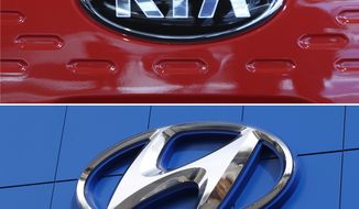 FILE- This combination of file photos shows the logo of Kia Motors during an unveiling ceremony on Dec. 13, 2017, in Seoul, South Korea, top, and a Hyundai logo on the side of a showroom on April 15, 2018, in the south Denver suburb of Littleton, Colo., bottom. The Korean automakers are recalling over 591,000 vehicles in the U.S. to fix a brake fluid leak that could cause engine fires.  (AP Photo, File)
