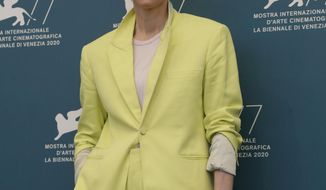 Actress Tilda Swinton poses during the photo call for the movie &#39;The human voice&#39; during the 77th edition of the Venice Film Festival at the Venice Lido, Italy, Thursday, Sep. 3, 2020. The Venice Film Festival goes from Sept. 2 through Sept. 12. Italy was among the countries hardest hit by the coronavirus pandemic, and the festival will serve as a celebration of its re-opening and a sign that the film world, largely on pause since March, is coming back as well. (AP Photo/Domenico Stinellis)
