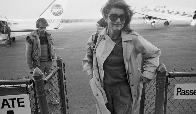 FILE — In this Nov. 21, 1983 file photo Jacqueline Kennedy Onassis arrives at the Barnstable Airport, in Hyannis, Mass., to observe the 20th anniversary of the assassination of President John F. Kennedy. The Martha’s Vineyard estate of the former first lady is being sold to a pair of nonprofits that plan on turning the property into conservation land open to the public, officials said Thursday, Sept. 3, 2020. (AP Photo/Paul Benoit, File)