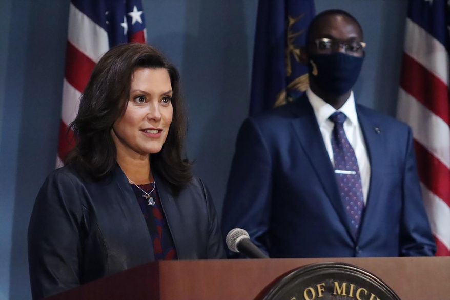 FILE - In this Tuesday, Sept. 2, 2020 file photo provided by the Michigan Office of the Governor, Gov. Gretchen Whitmer addresses the state during a speech in Lansing, Mich., heir status amid the coronavirus pandemic. Whitmer says gyms can reopen after 5 1/2 months of closure and organized sports can resume if masks are worn. She lifted some coronavirus restrictions Thursday, Sept. 3, 2020, that lasted longer in Michigan than in many other states. The order, effective next Wednesday, allows for reopening fitness centers and indoor pools in remaining regions that hold 93% of Michigan&#39;s population.(Michigan Office of the Governor via AP)