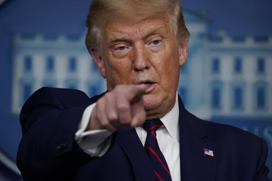 President Donald Trump points to a reporter to ask a question during a news conference in the James Brady Press Briefing Room at the White House, Friday, Sept. 4, 2020, in Washington. (AP Photo/Evan Vucci)