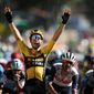Belgium&#39;s Wout Van Aert celebrates as he crosses the finish line to win the seventh stage of the Tour de France cycling race over 168 kilometers (105 miles), with start in Millau and finish in Lavaur, Friday, Sept. 4, 2020. (Benoit Tessier/Pool via AP)