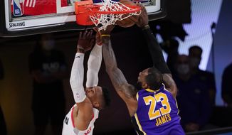 Los Angeles Lakers&#x27; LeBron James (23) blocks a shot by Houston Rockets&#x27; Russell Westbrook (0) during the second half of an NBA conference semifinal playoff basketball game Friday, Sept. 4, 2020, in Lake Buena Vista, Fla. (AP Photo/Mark J. Terrill)