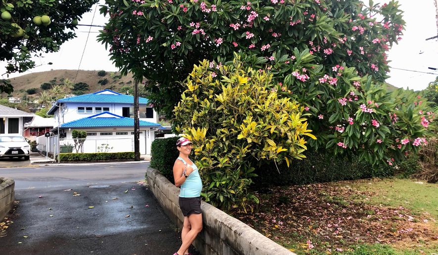 At five months pregnant, reporter Jennifer Kelleher sets out for a morning run in Honolulu on Friday, Aug. 28, 2020. (Courtesy of Jennifer Sinco Kelleher via AP)
