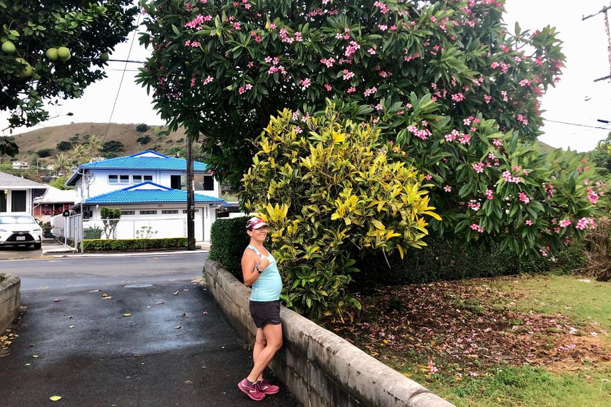 At five months pregnant, reporter Jennifer Kelleher sets out for a morning run in Honolulu on Friday, Aug. 28, 2020. (Courtesy of Jennifer Sinco Kelleher via AP)