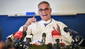 Alberto Zangrillo, Silvio Berlusconi&#39;s longtime physician, talks to reporters at the San Raffaele hospital in Milan, Friday, Sept. 4, 2020. Former Premier Silvio Berlusconi, who tested positive for COVID-19 this week, has an early-stage lung infection but was breathing on his own Friday after being hospitalized in Milan, his personal physician said. Alberto Zangrillo, who is also on the staff of San Raffaele hospital, where Berlusconi was taken in the early hours of the day, told reporters that test results are reassuring and “makes us optimistic” for his recovery over the next “hours and days.” (Claudio Furlan/LaPresse via AP)