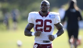 Washington running back Adrian Peterson (26) works out during practice at the team&#39;s NFL football training facility, Monday, Aug. 24, 2020, in Ashburn, Va. (AP Photo/Nick Wass)