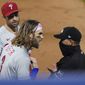 Philadelphia Phillies&#x27; Bryce Harper, front left, argues with umpire Roberto Ortiz, right, after Ortiz ejected Harper during the fifth inning of the team&#x27;s baseball game against the New York Mets, Saturday, Sept. 5, 2020, in New York. (AP Photo/John Minchillo)
