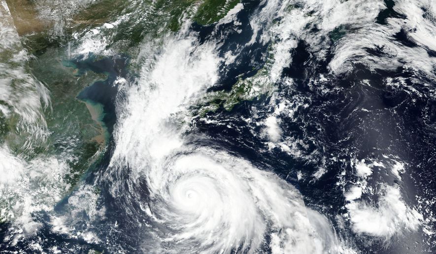 This Saturday, Sept. 5, 2020, satellite image released by NASA Worldview, Earth Observing System Data and Information System (EOSDIS) shows Typhoon Haishen barreling toward the Okinawa islands in southern Japan on Saturday, prompting warnings about torrential rainfall and fierce wind gusts. Weather officials have cautioned about Typhoon Haishen for the last several days, urging people to brace for what could be a record storm and be ready to take shelter and stock up on food and water. (NASA via AP)
